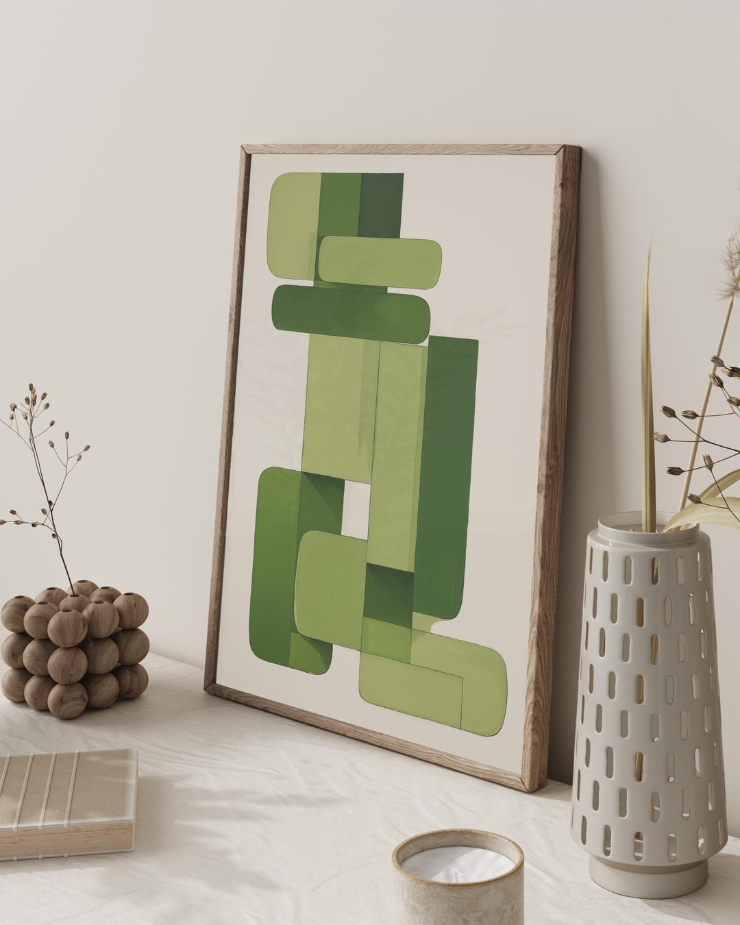 Luxury minimal bedroom dressing room with scant plant holder and large modern green abstract geometric poster print in oak frame